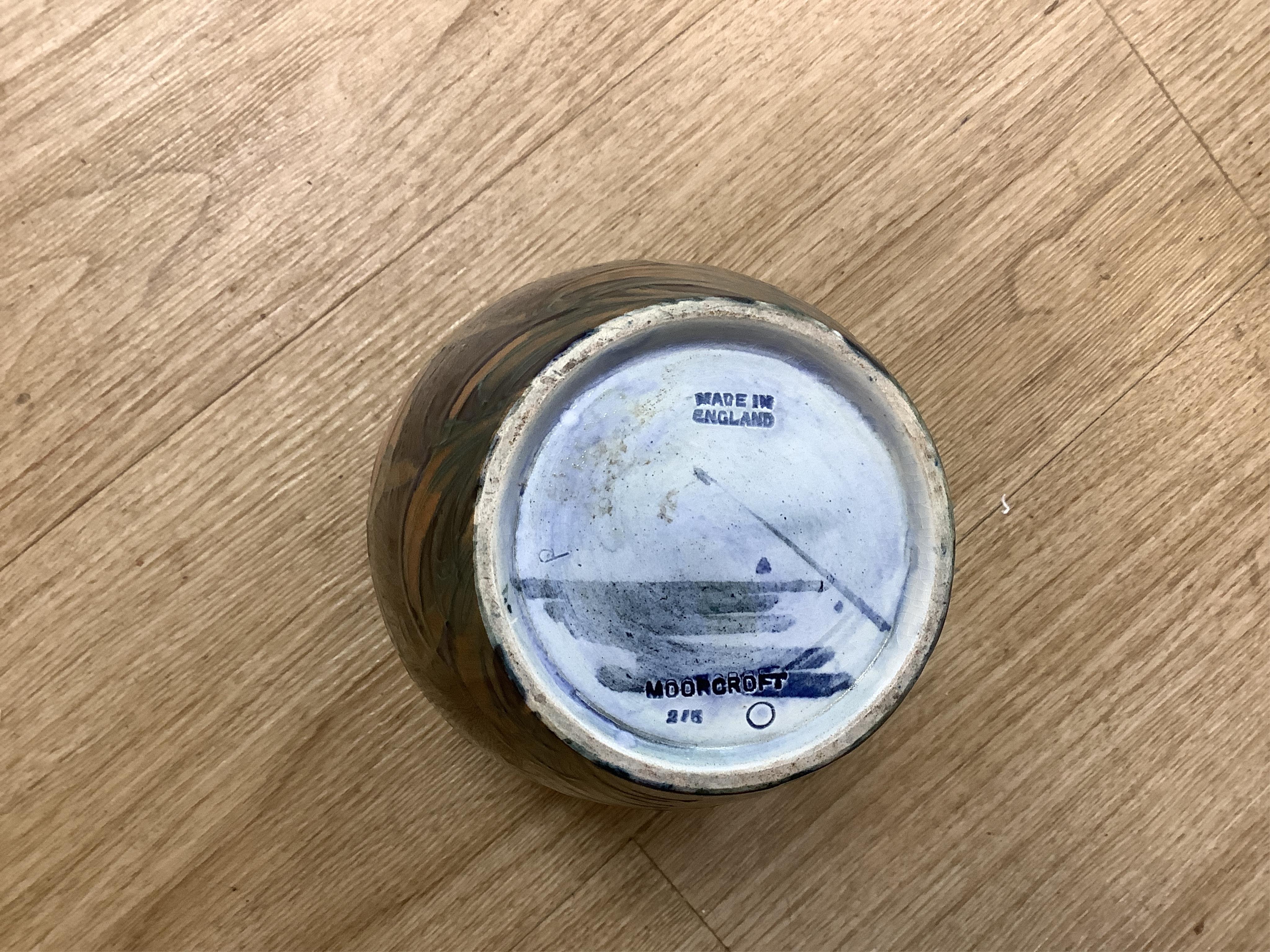 Three Moorcroft vases and a Moorcroft Hibiscus jar and cover, largest 25cm high